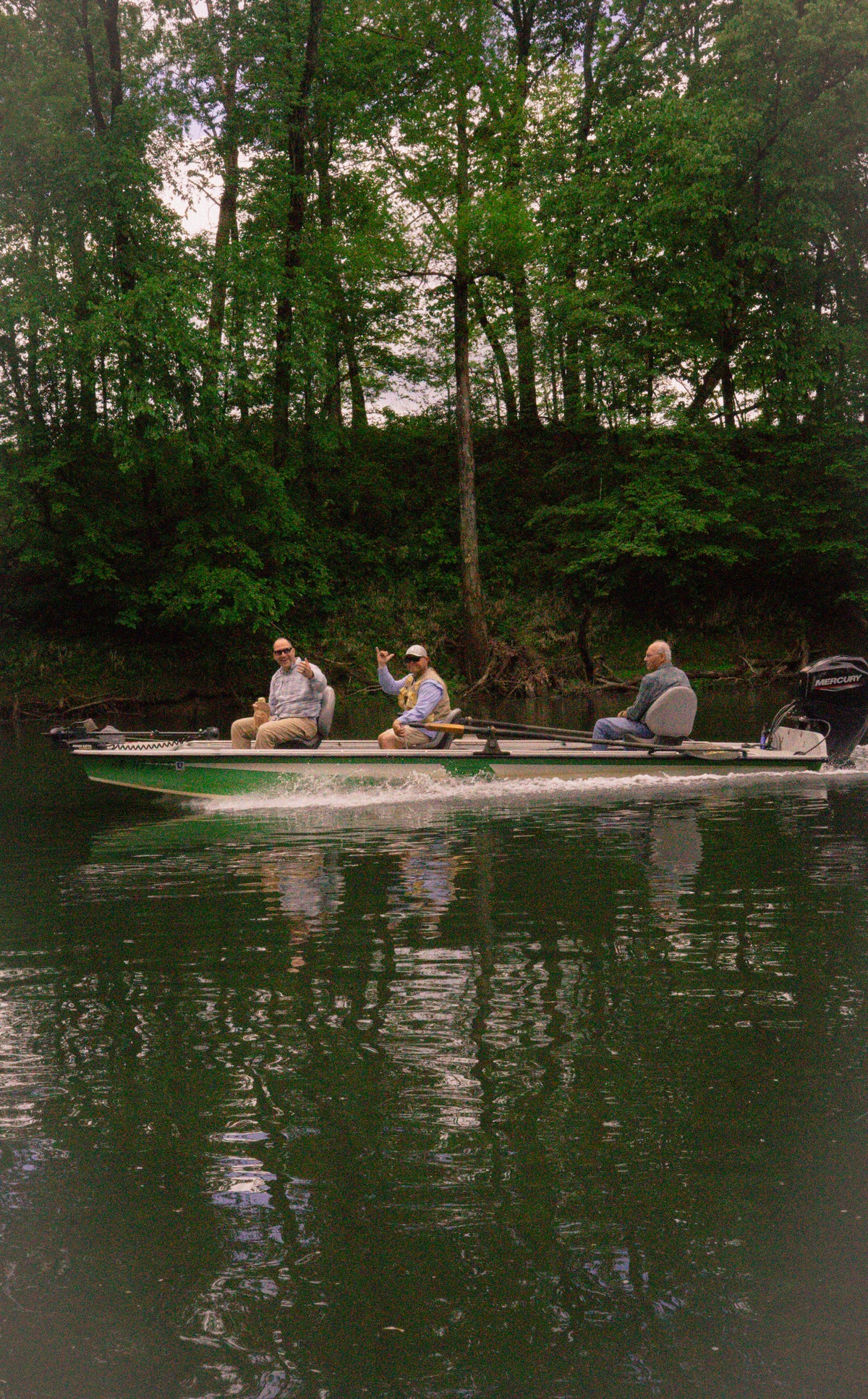 Three generations fishing a river